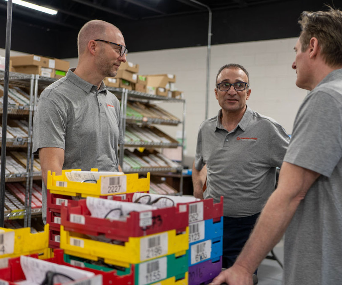 Premier Vision Lab leadership on the production floor.